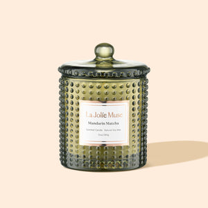 Product Shot of Marvella - Mandarin Matcha 10oz candle in the middle