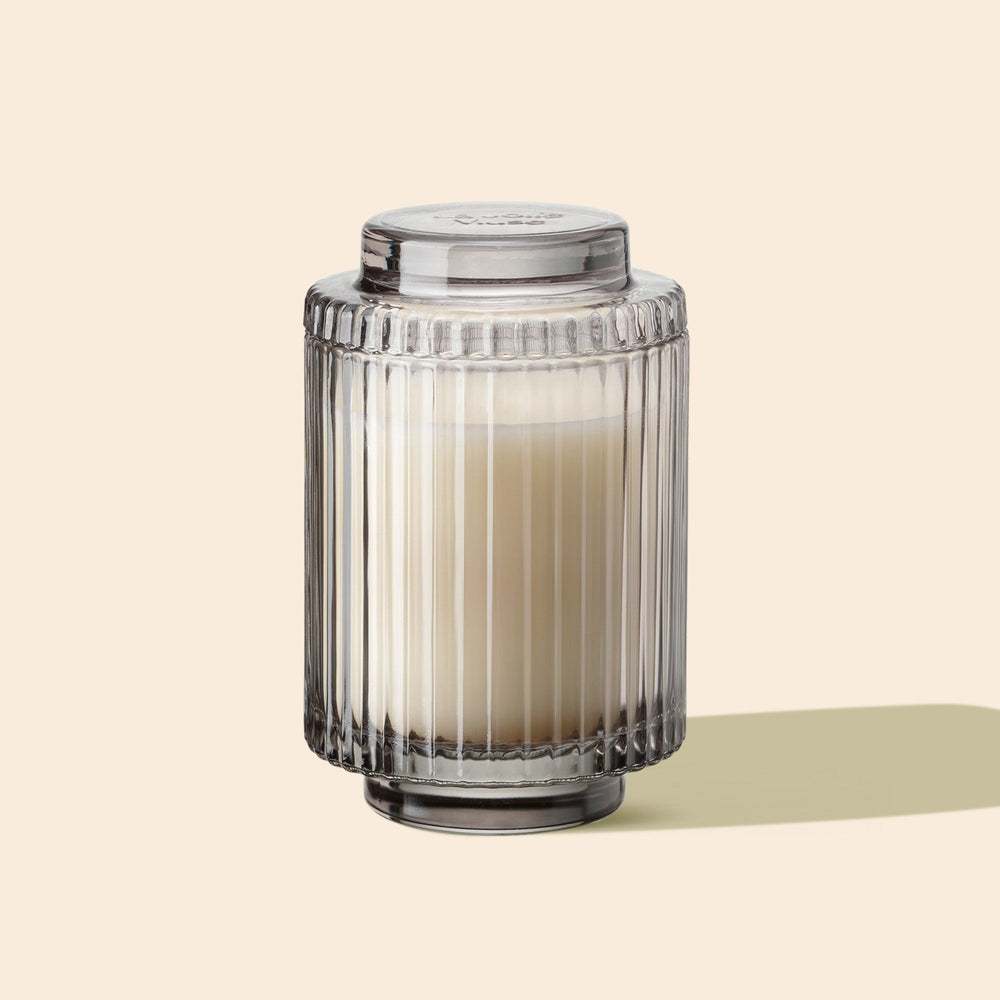 Product Shot of Amélie - Linen Cotton Oasis 11oz candle in the middle