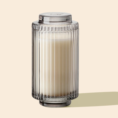 Product Shot of Amélie - Linen Cotton Oasis 19oz candle in the middle