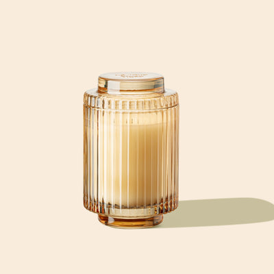 Product Shot of Amélie - Tahitian Lychee 7oz candle in the middle