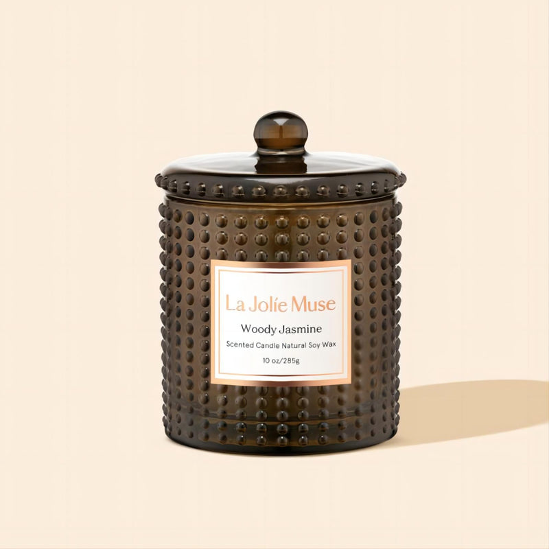 Product Shot of Marvella - Woody Jamine 10oz candle in the middle