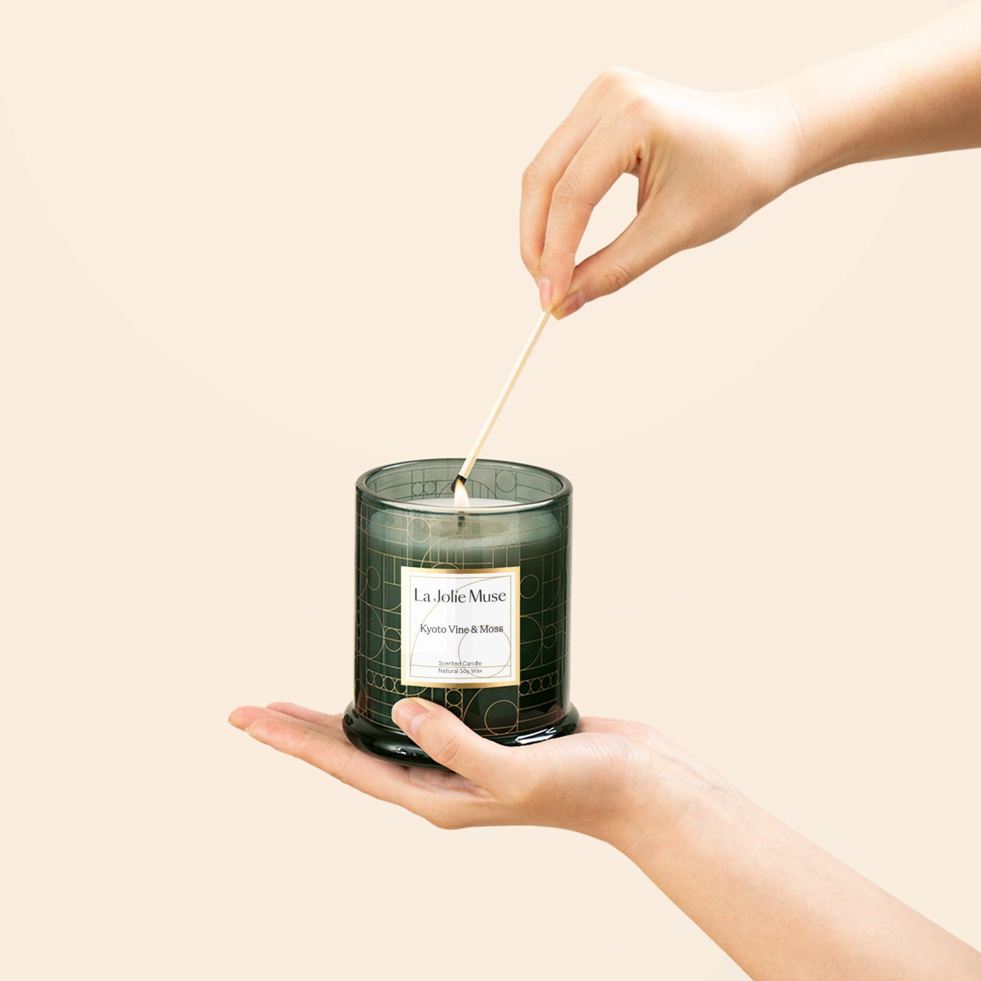 Photo shot of lighting Roesia - Kyoto Vine & Moss 10oz candle with a match candle with a match