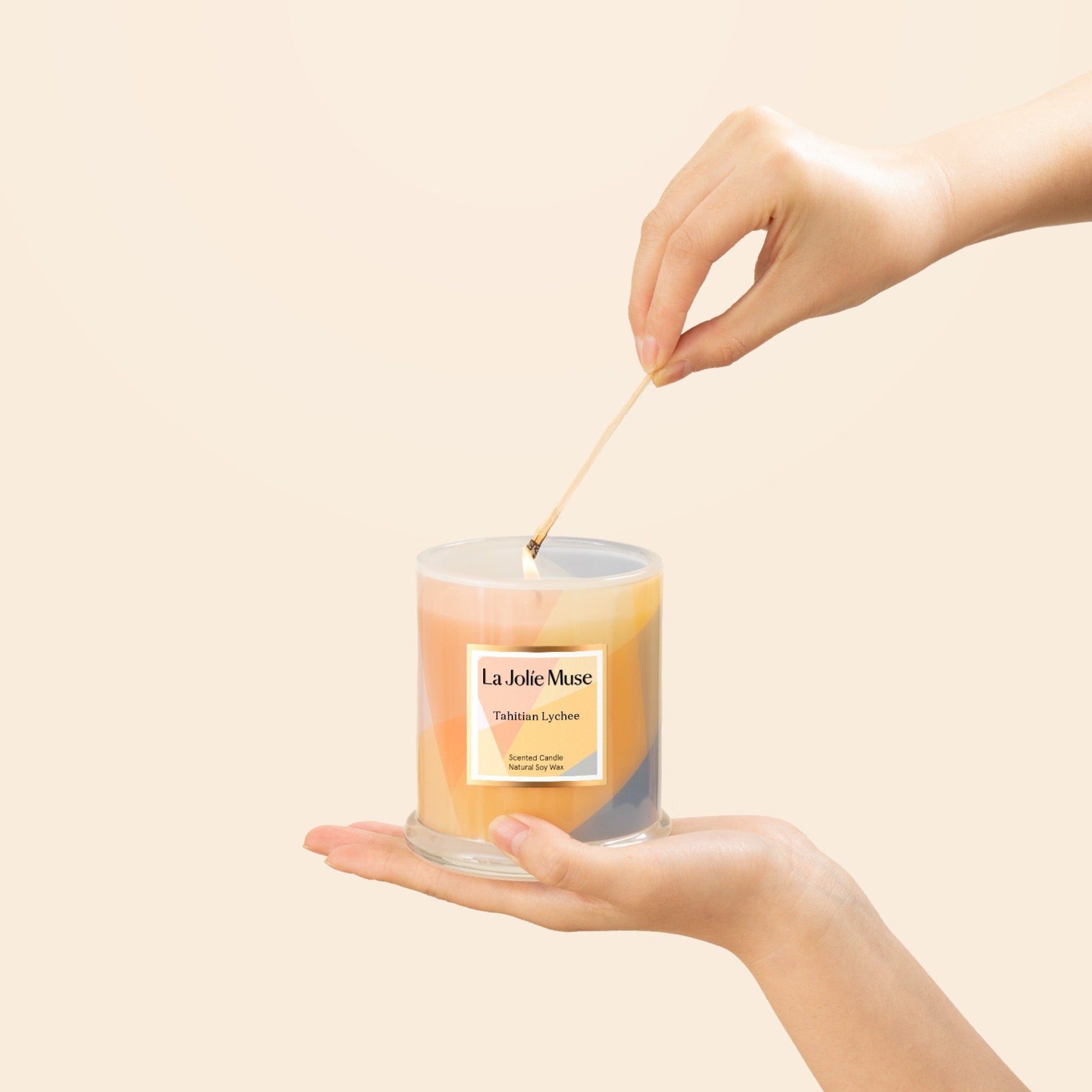 Photo shot of lighting Roesia - Zest Tahitian Lychee 10 oz candle with a match