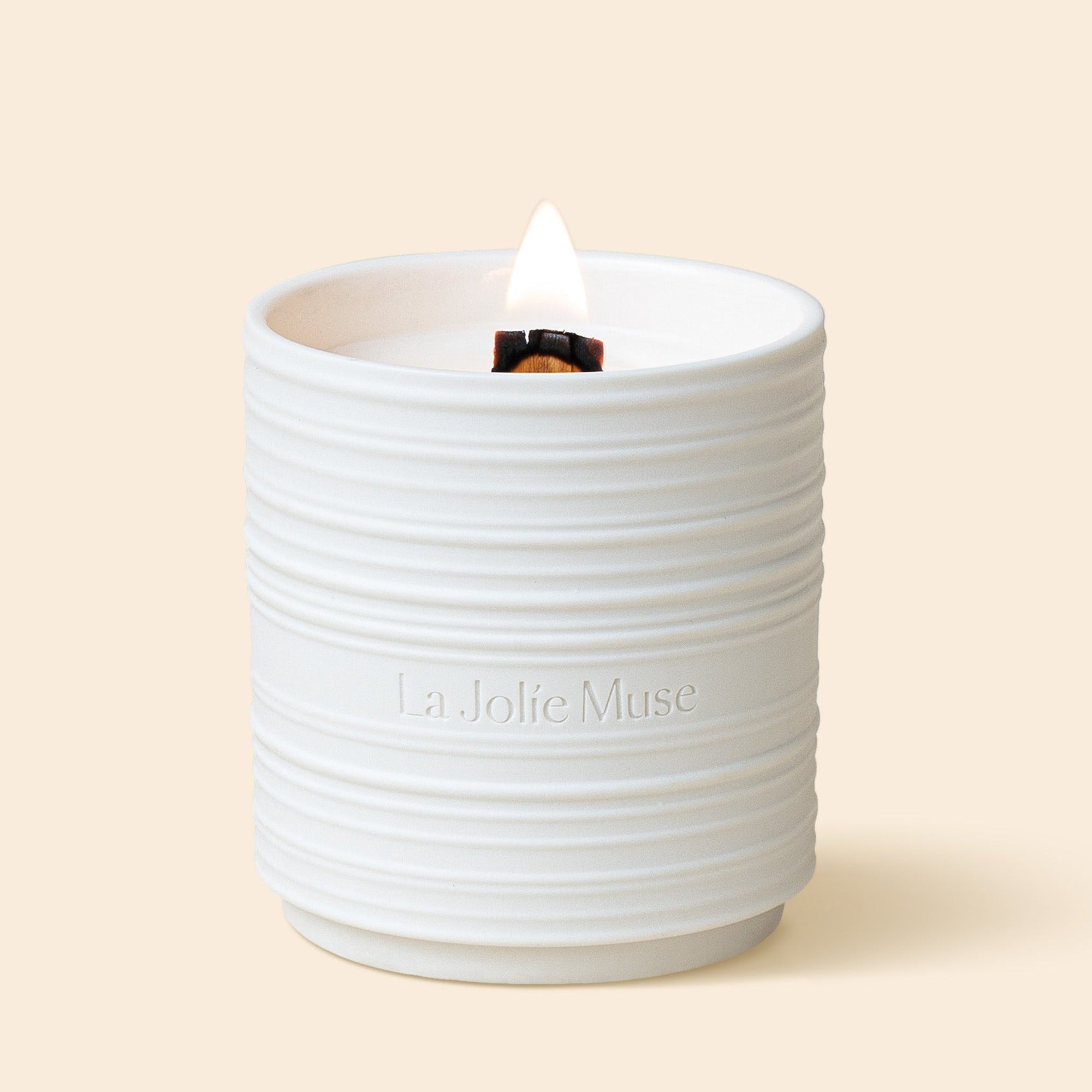 Product Shot of Lucienne - Linen Cotton Oasis 15oz candle in the middle