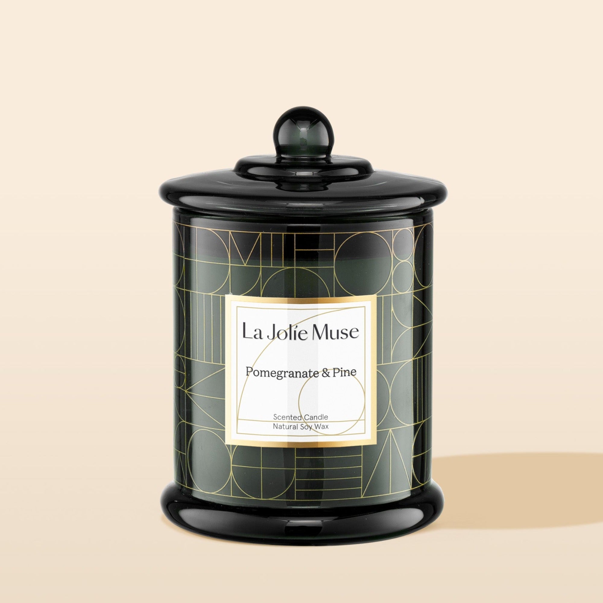 Product Shot of Roesia - Pomegranate & Pine 10oz candle in the middle