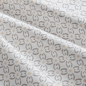 Sofia Geometric Floral 300 thread count Cotton Sateen Sheet Set. Close up of white and geometric floral patterned sheet set.