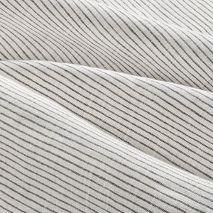 Close up details of Olivia black and white stripe linen duvet set. Black and white striped linen bedsheet duvet sheet close up.