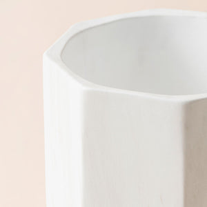 A close-up of the 6.7-inch planter, showing the marble pattern around the exterior surface and its geometric rim.
