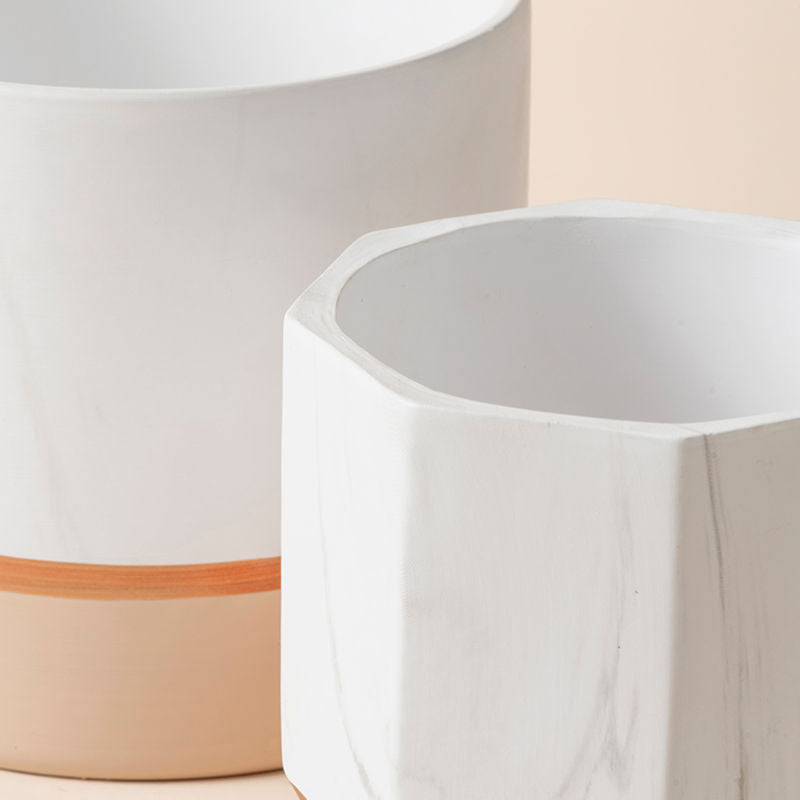 A close-up of the planter set, showing the difference in height and its marle design pattern.