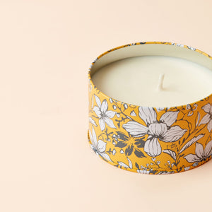 A close up of Orange and Bergamot Scented Candle, displaying its white cotton wick.