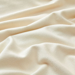 A close-up of the fabric, showing its skin-friendly and soft features.
