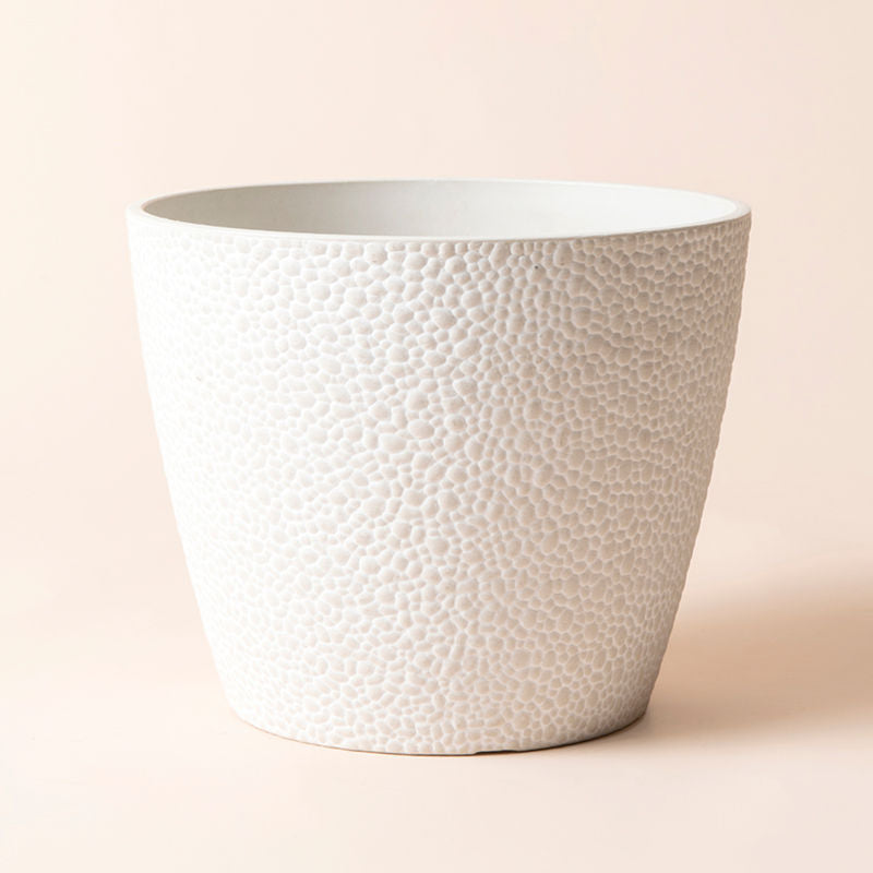 The ares white stone pot in 9.4-inch is made of recyclable plastic.
