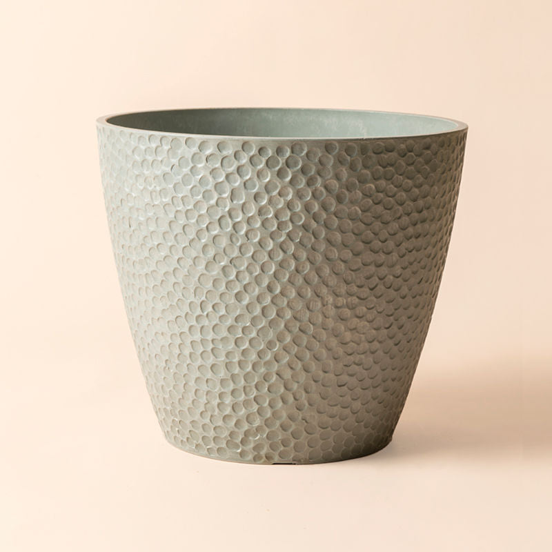 A complete view of a 14-inch pot, made with recyclable plastic with unique honeycomb design on its exterior. 