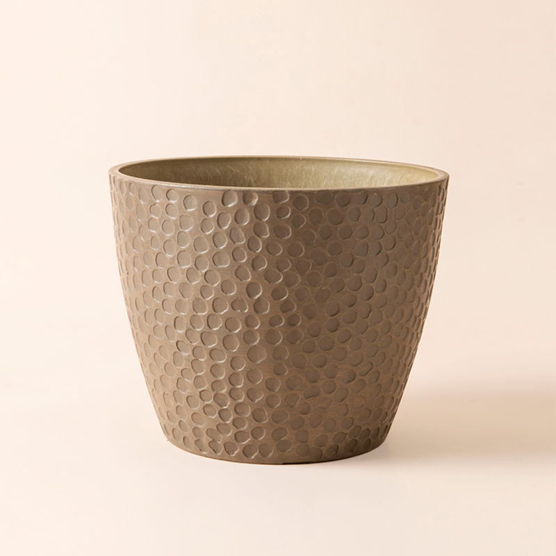 An overview of a brown color plastic pot with honeycomb design.