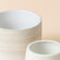 A close-up picture of the patterns on the Allen pots set. The left one is in beige, and the right one is creamy green.