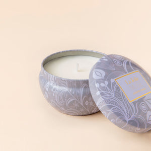 A close up of Blue Lotus candle with Tulip Scented, showing its cotton wick.