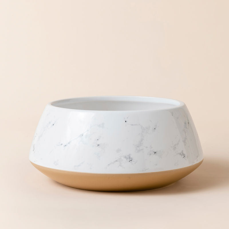 The full view of the boj splash ink and sandy beige pot, decorated with marble-like patterns around the exterior.