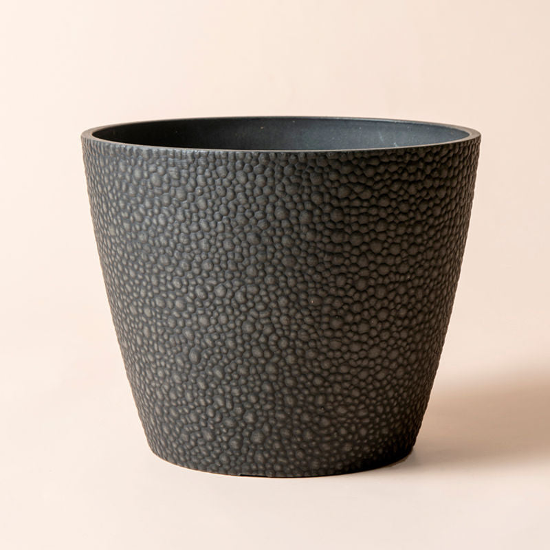 A full view of charcoal black planter, Made from recyclable plastic and natural stone powders.