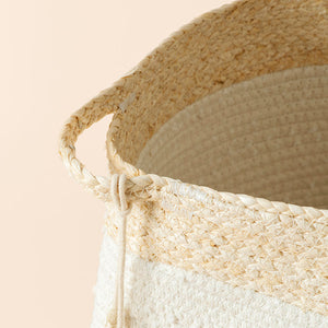 A close-up of the cotton rope and corn skin hamper from top, showing its durable corn skin handle on the side.