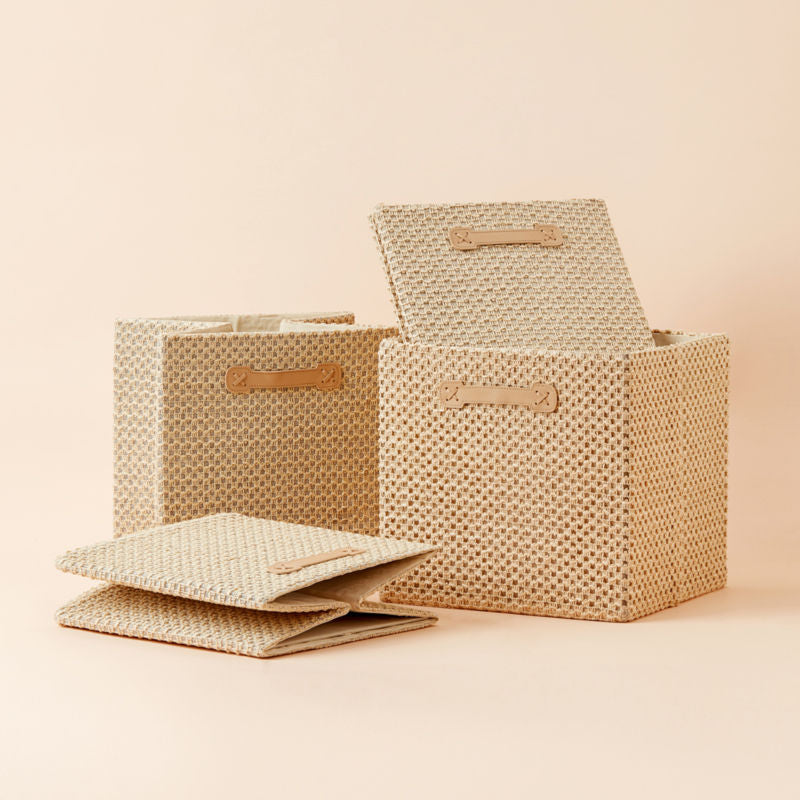 Each set contains four storage cubes in one size. The wicker basket-style cube that folds and holds fits with your bookshelves.
