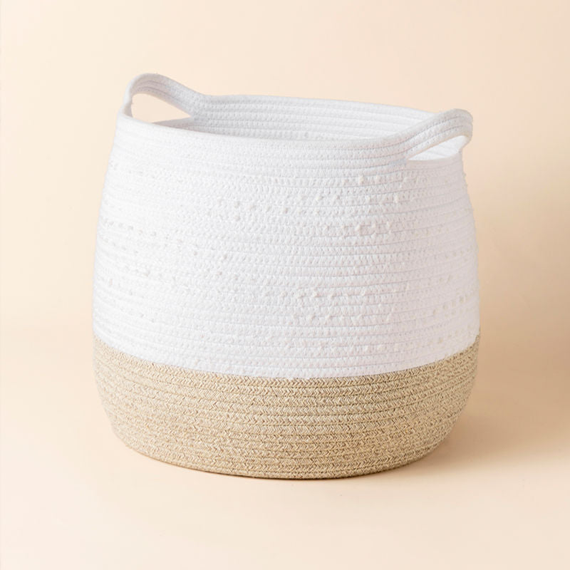 A full view of white and beige cotton rope storage basket, showing it natural cotton features with two handles.