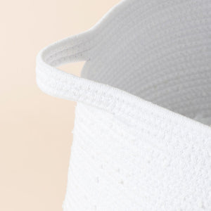A close-up of the cotton rope laundry basket, showing its 100% cotton rope feature and durable handle.