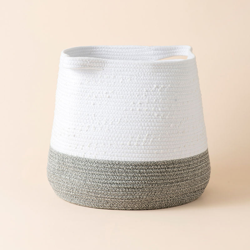A full view of white and gray cotton rope storage basket, the 15" height provides a large storage space.