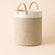 The beige-sand color palette cotton rope storage basket, made of 100% cotton with two handles.