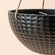 A close up of matte black hanging planter, showing its unique geometric pattern and sturdy hanging rope.