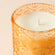 A close up of Midnight Tulip candle, showing its cotton wick.