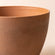 A close up of terracotta pot, showing its grainy texture and large dimension in 11.3 inches.