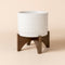 The gems white pot in 8-inch is made of premium ceramic, with a wooden stand at the bottom.