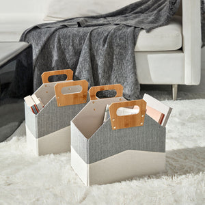 A pair of urban gray baskets with handles displayed on a white carpet in the living room. 