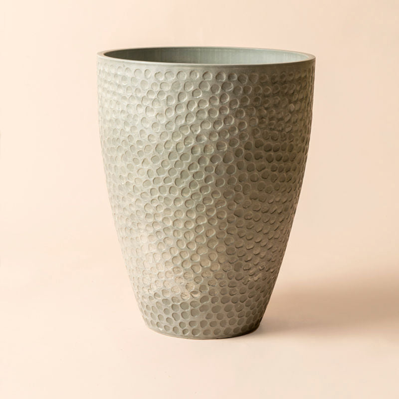 The 14.2-inch tall gray plastic pot is decorated with honeycomb patterns. 11.4″ in upper dimension and 6.1″ in the bottom.