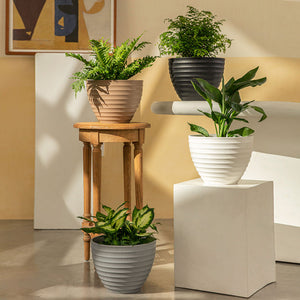 A series of Greece planters in different colors are displayed in a staggered way, including a black pot in 10.2 inches.