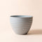 The light gray planter in 10.2-inch with minimalist ridges decoration around the exterior.