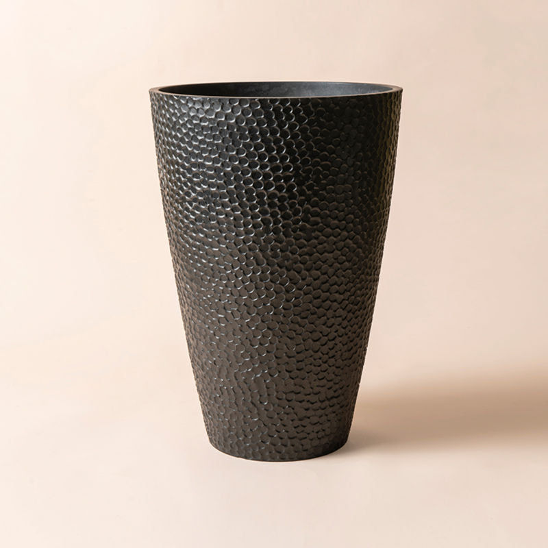 A black pots decorate with special honeycomb patterns around the exterior. 20-inch in height made the planter a great fit with small trees. 
