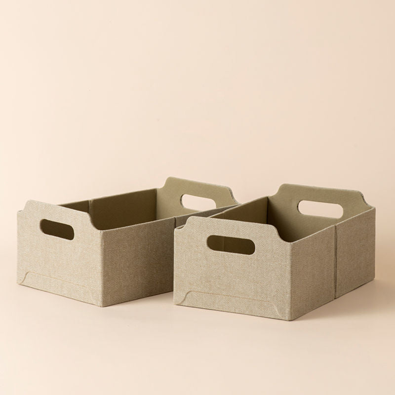 A set of two rectangular storage baskets in khaki color, made of tweed and recyclable cardboard.
