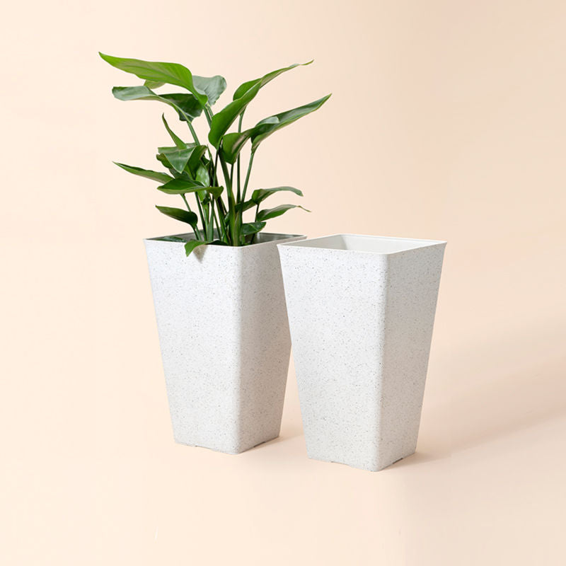 A full view of the lenn speckled white pots set, with two 20-inch planters within the set.