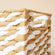 A close-up of the paper rope basket, showing its white and beige woven design pattern.