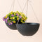 A set of two 13.2-inch black hanging pots, made from recyclable plastic and natural stone powders.