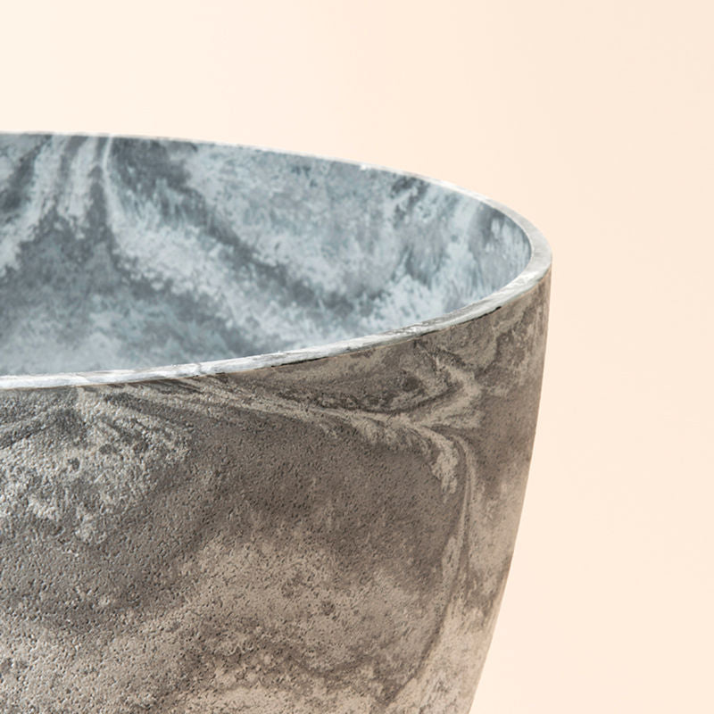 A close-up of the nova planter, showing its marble-like patterns and smooth rim feature.