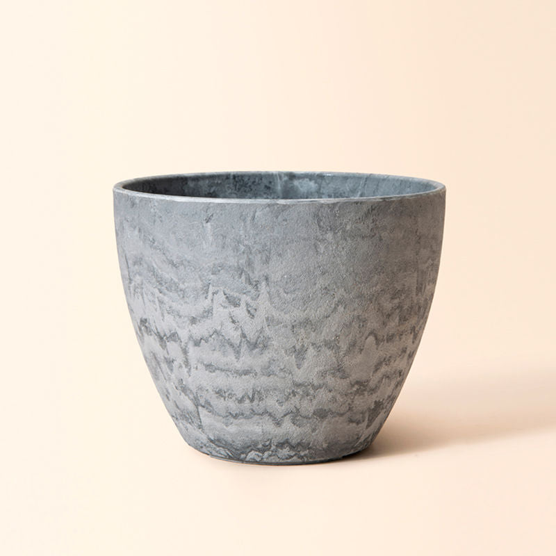A full view of the 8.6-inch nova marble pot, with the design of grey-white marble pattern in waves on the body.