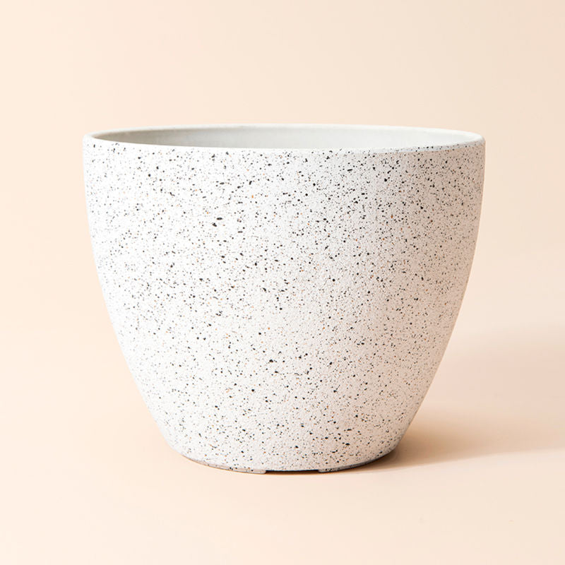 A full view of a 8.6-inch speckled white planter, made from recyclable durable plastic and natural stone powder.