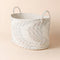 A close-up of cotton rope storage basket, showing its mint woven pattern and inner fabric.
