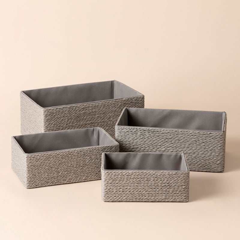 A full view of Izar gray paper rope baskets Set. Four different sizes of storage baskets stand in a staggered way.