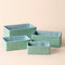 A set of Izar mint storage basket, displayed in a staggered way. Each set contains four different sizes.