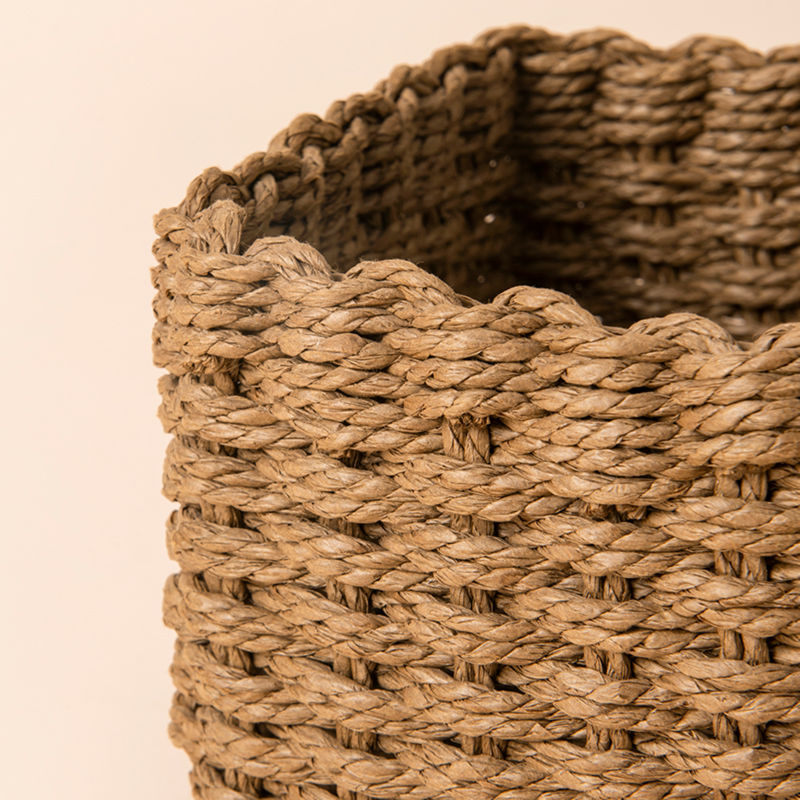 A close-up of paper rope storage basket, showing its woven pattern and durable.