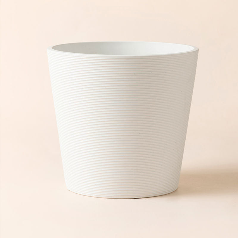 A full view of Remco matte white pot in 8 inches, made from plastic and stone powders.  