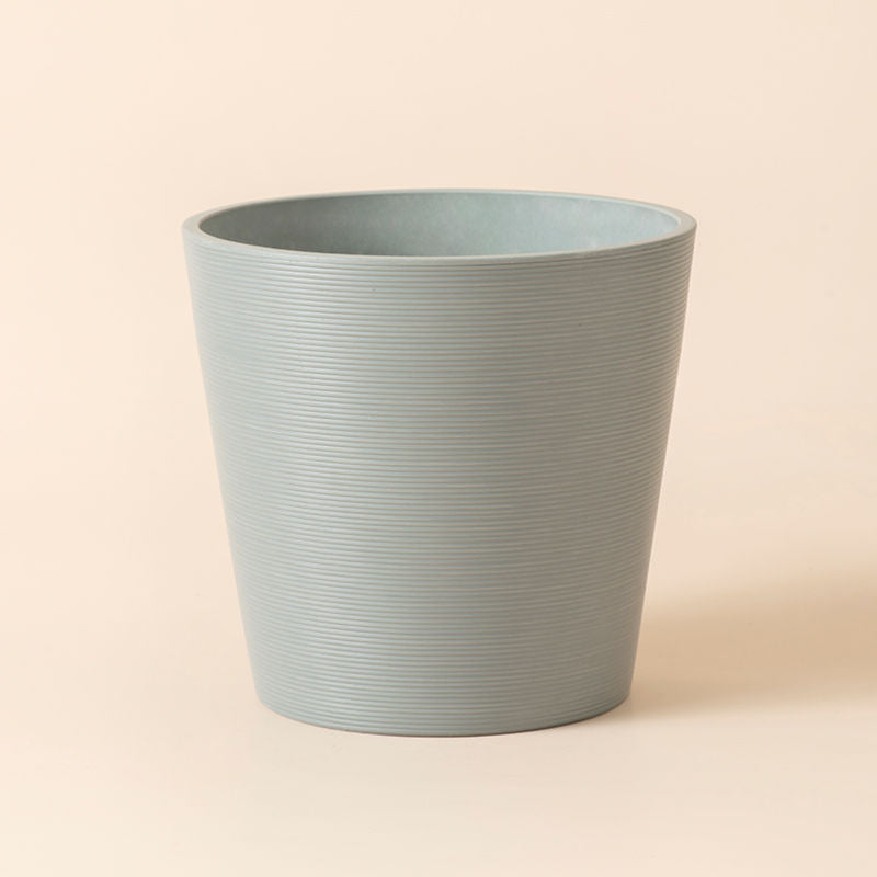 The full view of the 8-inch Remco light cement gray pot. The planter is made of plastic for weathered resistance.